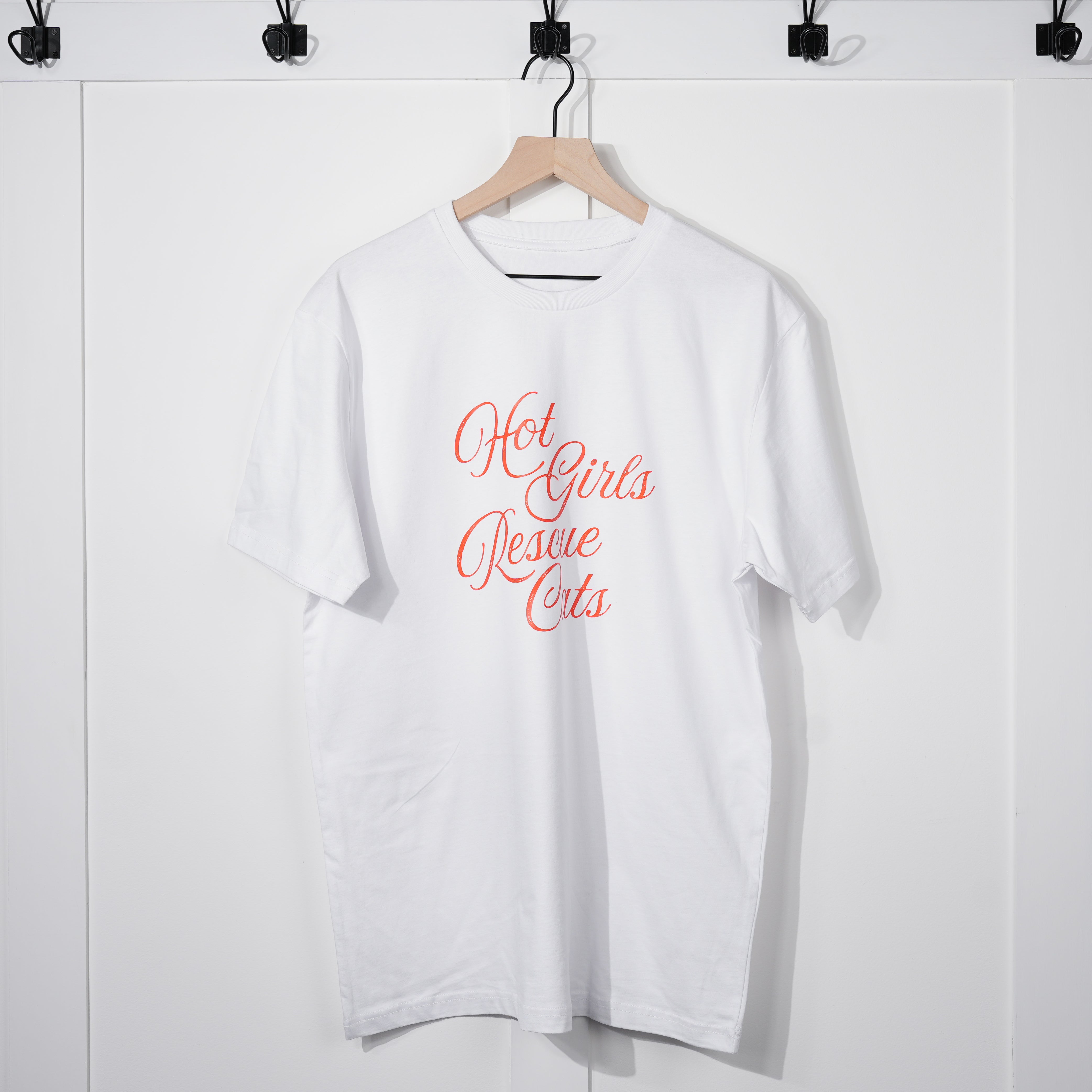 White t-shirt with 'Hot Girls Rescue Cats' text on a hanger against a white background
