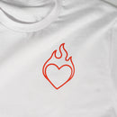 White t-shirt with a red heart and flame design on a white background